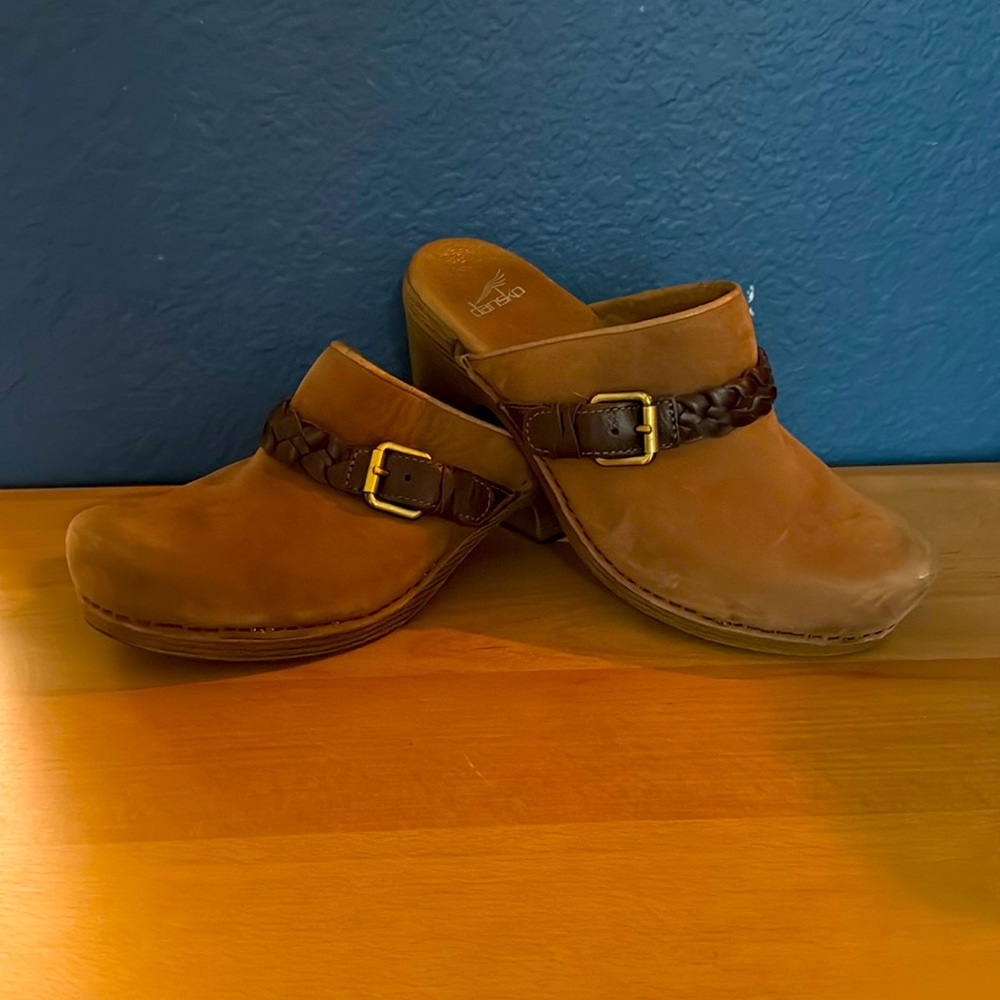 Size 39 Dansko open heel clogs with braided leather detail and buckle.